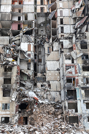 Ruins of a residential building as a result of a rocket attack in the North Saltivka area of Kharkiv. The missile attack that destroyed this building is just one example of the brutality and inhumanity of the Russian invasion. The ruins of this residential building stand as a haunting reminder of the price paid by innocent civilians in the conflict in Ukraine.