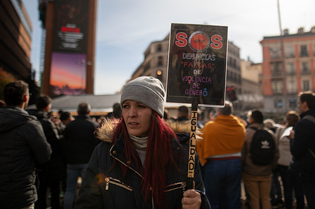 A protester displays a placard during a demonstration. Demonstration was organized by several associations in front of the Ministry of Equality in Madrid, protesters demanded that public policies on gender violence include all victims. The protest denounced the fact that current legislation excludes men and boys who also suffer abuse within the family.
