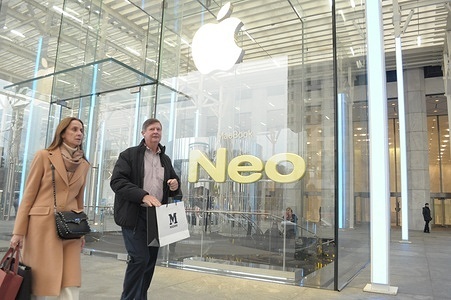 People exit an Apple store on Fifth Avenue in Manhattan, New York City.