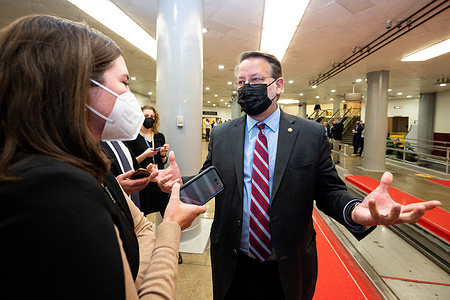 U.S. Senator Gary Peters (D-MI) talks to reporters near the Senate Subway.