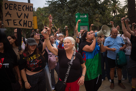 A protester is seen showing her keys during a nationwide protest following the eviction of an elderly woman in Madrid and demanding decent housing. Mass protests erupted across Spain after 87-year-old Maricarmen Abascal was removed from her Madrid apartment of seven decades following an unaffordable rent hike by an investment fund. The incident sparked nationwide sit-ins and political pressure, forcing the Spanish coalition government to advance urgent legislation banning evictions and capping rent prices.