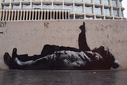 A new artwork, suspected to be by elusive street artist Banksy, has appeared outside Centre Point and Tottenham Court Road Station. The artwork depicts two children lying on their backs with one child pointing upwards.