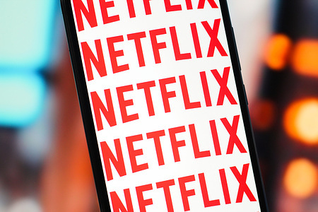 In this photo illustration, the Netflix logo is seen displayed on a smartphone screen.