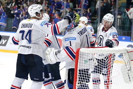 Kirill Zhukov (74) and Alexander Trushkov (1) of Lada Hockey Club seen in action during the Hockey match, Kontinental Hockey League 2025/2026 between SKA Saint Petersburg and Lada Togliatti at the Ice Sports Palace. (Final score; SKA Saint Petersburg 6:1 Lada Togliatti).