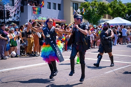 Members of the leather community seen dancing in leather attire and rainbow accessories while marching during the Pride parade. Thousands of people took part in the 2026 San Diego Pride Parade, celebrating the LGBTQ+ community while promoting visibility, equality, inclusion and LGBTQ+ rights.