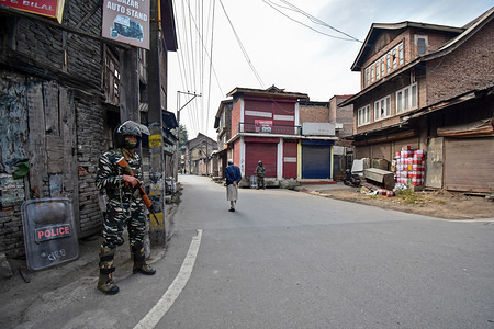 A paramilitary trooper stands on guard during the restriction.
Authorities on Friday imposed restrictions in old city of Srinagar ahead of the Friday prayers to maintain law and order. Meanwhile, Kashmir valley continued to remain shutdown on the 89th consecutive day against the abrogation of Article 370 and bifurcation of Jammu & Kashmir state into two Union Territories by the government of India.