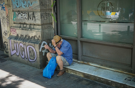 An elderly man seen relaxing due to a heatwave.
Greece officially emerged from its bailout program on Monday 20 August, after eight years of cutbacks enforced in return for massive loans and an economic collapse on the scale of the Great Depression.