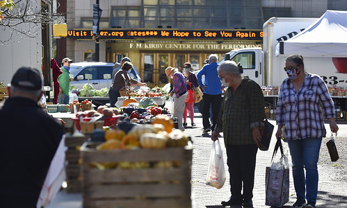 Shoppers wearing face masks as a preventive measure are seen at the outdoor farmers market.
Every Thursday there is a public Farmers Market in Public Square in Wilkes-Barre where most of the shoppers and farmers comply with the mask wearing.