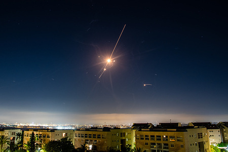 An Israeli Air defense system intercepted a ballistic missile barrage launched from Iran to central Israel during the missile attack.