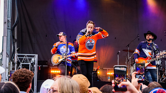 Dan Davidson with Three times Juno award and 22x Canadian Country Music award winner Brett Kissel and his band members perform at the Edmonton Oilers Tailgate Party prior to the 2nd game of the Stanley Cup Playoffs between the Edmonton Oilers and the Los Angeles Kings.