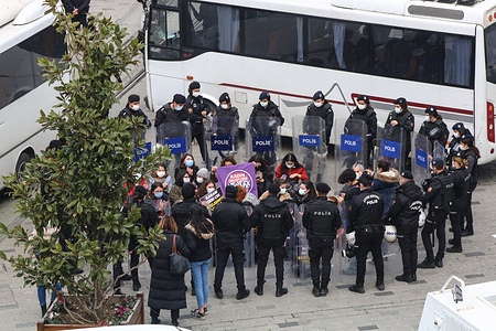 Police officers surround women taking part during the demonstration. Women gathered at Taksim Square in Istanbul to protest the withdrawal from the Istanbul Convention. Istanbul Convention, signed by 45 countries and the European Union, requires the prevention of all kinds of violence against women, protection of victims of violence and punishment of criminals.
