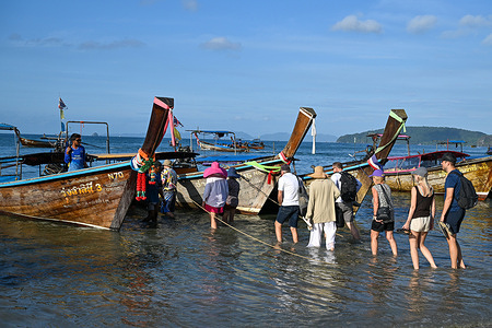 Tourists head out from Ao Nang Beach for island hopping.