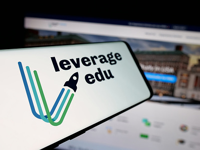 In this photo illustration, a smartphone with the logo of student platform company Leverage Edu is seen on screen in front of website.