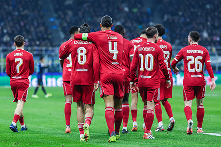 Virgil Van Dijk of Liverpool FC hugs and celebrates with Dominik Szoboszlai of Liverpool FC during the UEFA Champions League 2025/26 League Phase - Matchday 6 football match between FC Internazionale and Liverpool FC at San Siro Stadium. Final Score; FC Internazionale 0:1 Liverpool FC