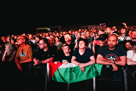 Fans watch as Massive Attack (not in view ) performs live during the Unaltrofestival festival at Parco della Musica.