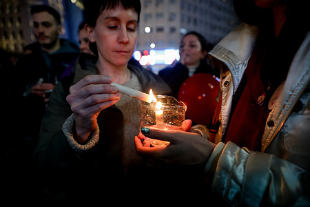 A protester holds a lit candle seen during the candlelight march in defense of the Garrahan Hospital. Members and patients of Garrahan Hospital marched demanding better wages and improved working conditions.