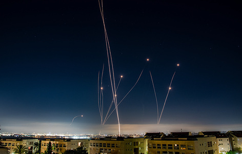 An Israeli Air defense system intercepts a ballistic missile barrage launched from Iran to central Israel during the missile attack.