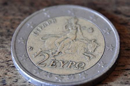 In this photo illustration, a Greek two euro coin front seen on display.