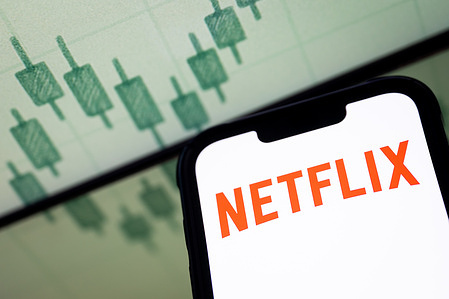In this photo illustration, a Netflix logo seen displayed on a smartphone screen.
