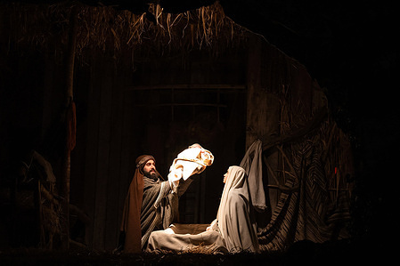 Actors portraying Joseph, Mary, and baby Jesus represent the Nativity during the Living Nativity Scene for the 40th "Il Presepe nel Presepe,". This Italian tradition brings a small town to life, recreating the nativity through immersive performances.
