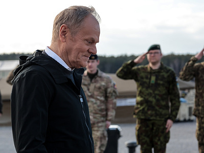 Prime Minister of Poland Donald Tusk attends a meeting with the Prime Minister of Norway Jonas Gahr Støre (not in view) in an armed forces training camp to initiate a tight military cooperation. Camp Jomsborg is a new training camp located in Poland and run by Norwegian military forces. Among other responsibilities it will train Ukrainian soldiers.