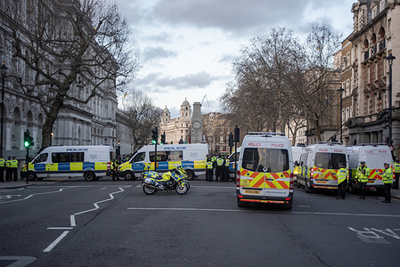 Police vans block the road on the Whitehall during the Kurdish demonstration. Hundreds of protesters from the Kurdish diaspora gathered outside Downing Street calling on the UK to take action against the Syrian military's offensive on Kurdish held area in the northeast Syria (Rojava).
