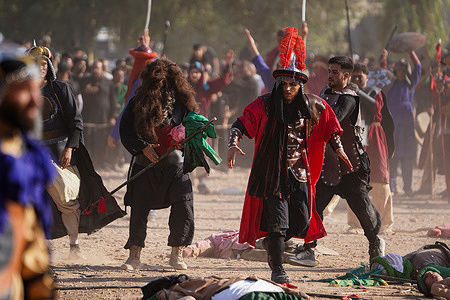 On the day of Ashura, Shiite Muslim re-enactors perform in a play about the 7th century AD battle of Karbala which coincides with 10th of Muharram according to the Islamic calendar commemorating the martyrdom of Prophet Mohammad's grandson Imam Hussein.