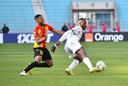 Hamdou El houni and Gilbert Baruti are seen in action during the CAF Champions League 2021 - 22 football match between Esperance sportive Tunisia and Jwaneng Galaxy Football Club in Rades.(Final Score: Esperance sportive 4:0 Jwaneng Galaxy Football Club)