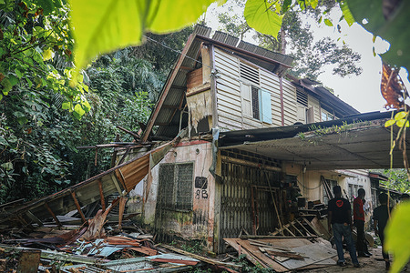 A damaged house after floodwater subsided in Kampung Ajai.
Floods in Malaysia caused by heavy monsoon rainfall affects most of Peninsular Malaysia.