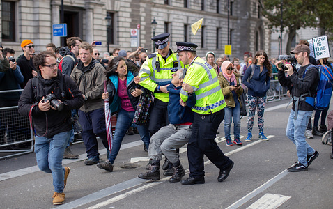 A protester is being arrested by police for obstruction of the highway during the demonstration.
Extinction Rebellion protesters finish their second day ahead of their proposed two weeks of action in London calling for the government to act on climate change.