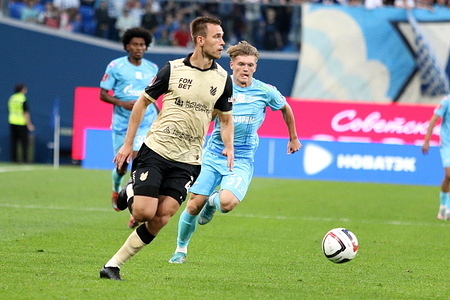 Konstantin Nizhegorodov (4) of Rubin and Vadim Shilov (51) of Zenit seen in action during the 2nd round of Group A of the Russian Cup football match between Zenit Saint Petersburg and Rubin Kazan at Gazprom Arena. Final score; Zenit 3:0 Rubin.