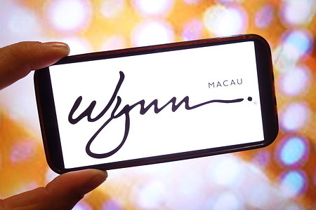 In this photo illustration, the Wynn Macau company logo is seen displayed on a smartphone screen.