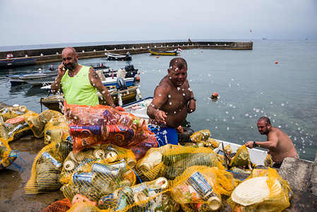 Calypso Dive Club members clear trash from the sea along Beirut's Corniche during the clean up day.
Lebanese people came out to help with a National Beach Clean up Day spearheaded by the Lebanese Minister for Environment. Not only did they collect trash from their beaches at over 150 locations, teams of scuba divers also spent their day underwater, clearing up everyone's waste from the ocean floor. Beirut, Lebanon.