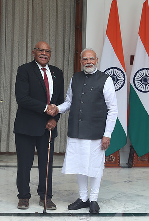 Prime Minister Narendra Modi (R) shakes hands with his Fiji counterpart Sitiveni Rabuka before their meeting. The two leaders focused on ways to expand collaboration between their two countries in a wide range of areas, including agriculture, defense and health.