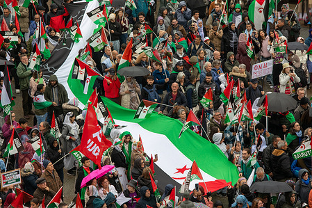 Protesters march with a giant Sahrawi flag during the demonstration. A demonstration through the streets of Madrid under the slogan "50 Years of Resistance of the Sahrawi People," the right to self-determination of the Sahrawi people was demanded.