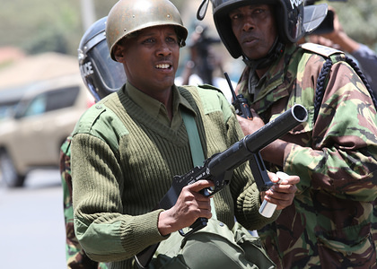 A police officer preparing himself to throw tear gas cannister at supporters during a protest.
The Opposition demonstrators knows as National Super Alliance (NASA) were blocked from entering the city center as Police used tear gas on them, while calling for the resignation of Independent Electoral and Boundaries commission blaming them for the August 8 presidential Election.