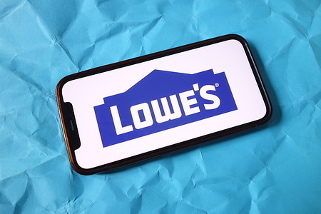 In this photo illustration, the Lowe`s Companies logo is seen displayed on a smartphone screen.