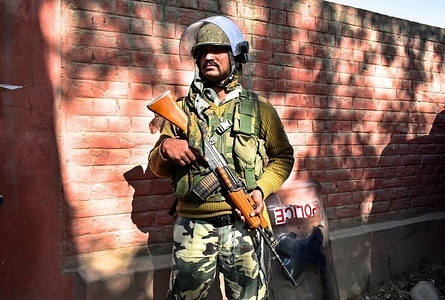 A paramilitary trooper stands guard outside the poling station during the first phase of local elections in Srinagar, Indian administered Kashmir. Amid tight security arrangements, voting began for the first phase of the urban local bodies (ULB) elections in Jammu and Kashmir on 08 October.