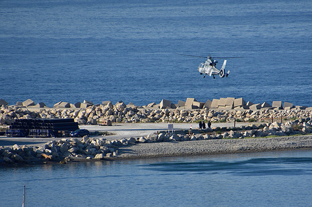 An AS565 Panther helicopter from the French Navy lands at the entrance to the port of Marseille.
