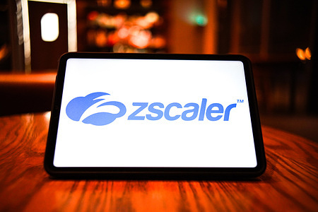 In this photo illustration, the logo of Zscaler is displayed on the screen of a smart tablet.