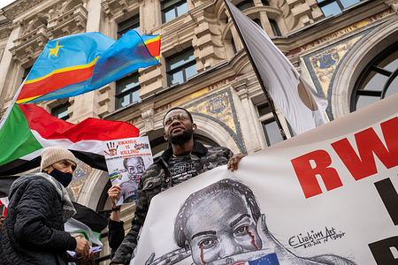 Congolese demonstrators hold up flags and placards during a protest. British Congolese held a demonstration in central London to draw attention to the exploitation of the countries natural resources by western technology companies.