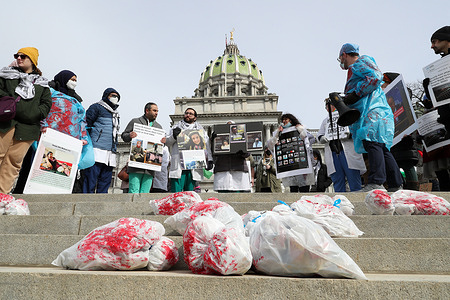 Protesters hold placards during the Healthcare Workers for Palestine Rally at the Pennsylvania State Capitol. The Harrisburg Palestine Coalition along with other organizations including the Pittsburgh Palestine Coalition, Penn State Students for Justice in Palestine, and Jewish Voice for Peace Philadelphia organized the rally to show solidarity with medical workers in Gaza and to call for an immediate ceasefire.