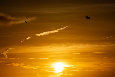 The surveillance blimps known as Fat Albert float over Cudjoe Key at sunset. The Tethered Aerostat Radar System is operated by U.S. Customs and Border Protection to monitor drug and immigration routes into Florida.