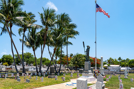 US Flags fly at the U.S.S. Maine Monument in Key West Cemetery in honor of Memorial Day in Key West. The U.S.S. Maine blew up in Havana Harbor on February 15, 1898, and the monument honors the victims of the disaster.