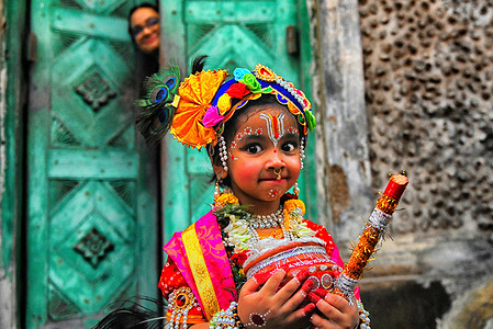 A child dressed as Lord Krishna poses for a photo during the Janmashtami festival celebration. Janmashtami festival is an annual Hindu festival that celebrates the birth of Krishna - the incarnation of Vishnu as per Hindu mythology.