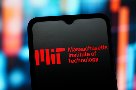 In this photo illustration, the MIT (Massachusetts Institute of Technology) logo is seen displayed on a smartphone screen.