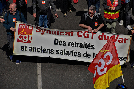 Protesters march with a banner expressing their opinion during the demonstration. Retirees have held protests in some 20 towns across France to demand higher pensions and better access to health care services. The protests started three weeks before the French presidential election, with the first round taking place on April 10, 2022.