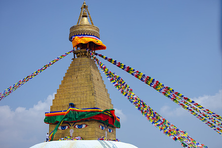 A Buddhist devotee offers prayer to Buddha during the Buddha Jayanti festival at Boudha Stupa, a UNESCO world heritage site. Buddha Jayanti is a special day for both Hindus and Buddhists in Nepal. On this day, people celebrate the life of Lord Buddha; his Birth, Enlightenment and Mahaparinirvana (Death).
