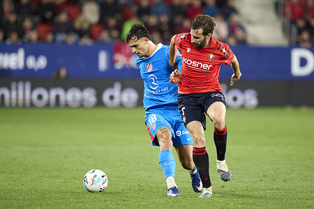 Jon Moncayola of CA Osasuna and Marc Pubill of Atletico Madrid seen in action during the Spanish football league match between CA Osasuna and Club Atletico Madrid at the Sadar Stadium. Final Score ;CA Osasuna 1:2 Atletico Madrid