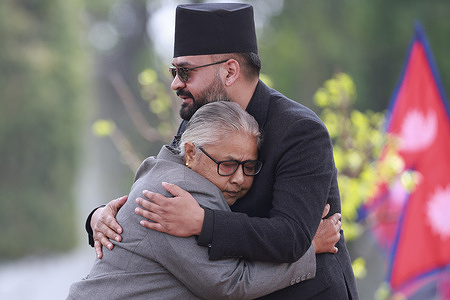 Newly appointed Prime Minister Balen Shah embraces interim Prime Minister Sushila Karki after the swearing in ceremony of the new prime minister and Council of ministers at the Presidential residence.